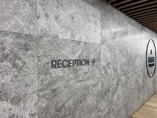 Level 12 wall signage pointing to Reception