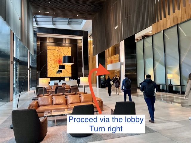 Collins Square lobby, proceed and turn right